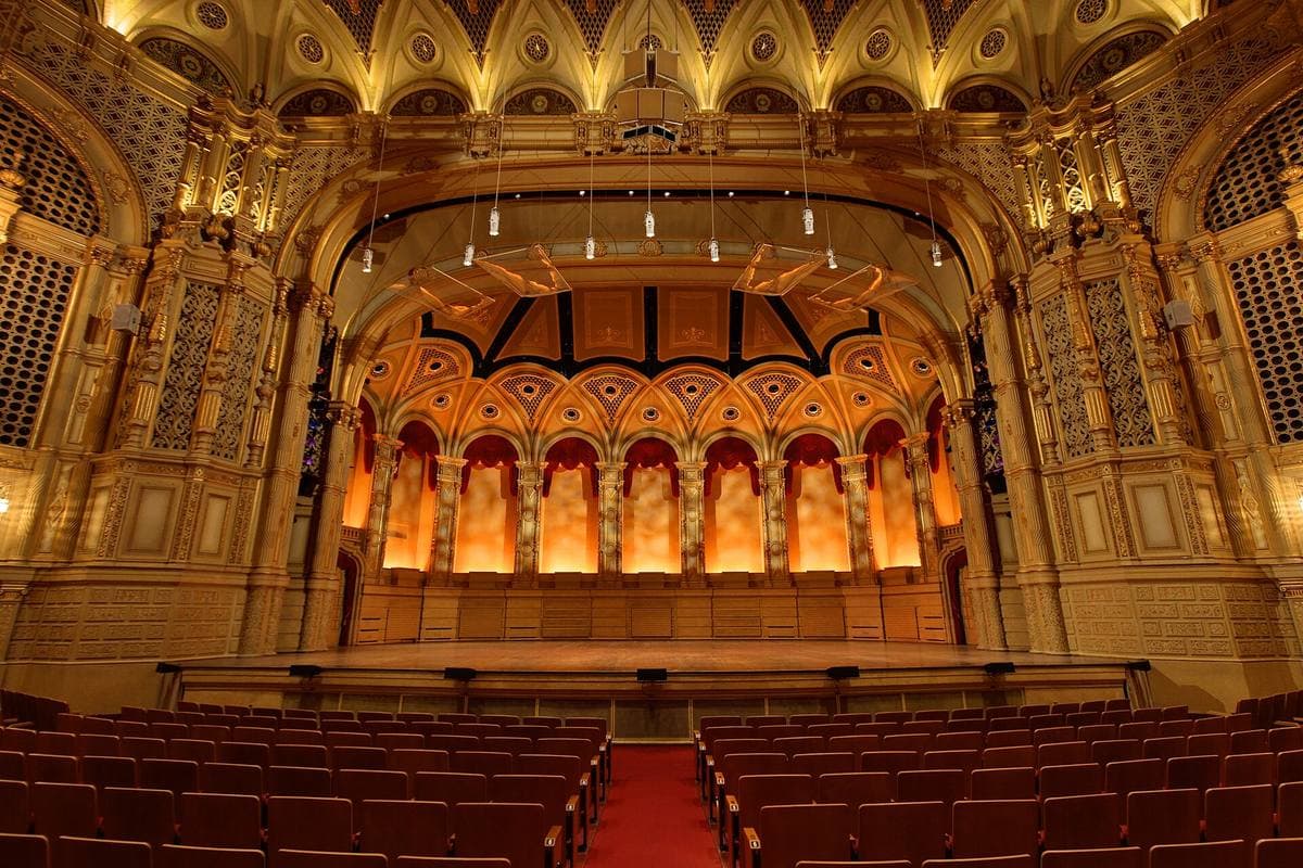 An ornate gilded theatre auditorium facing the stage
