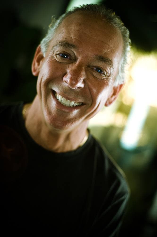 A man with short grey hair smiling