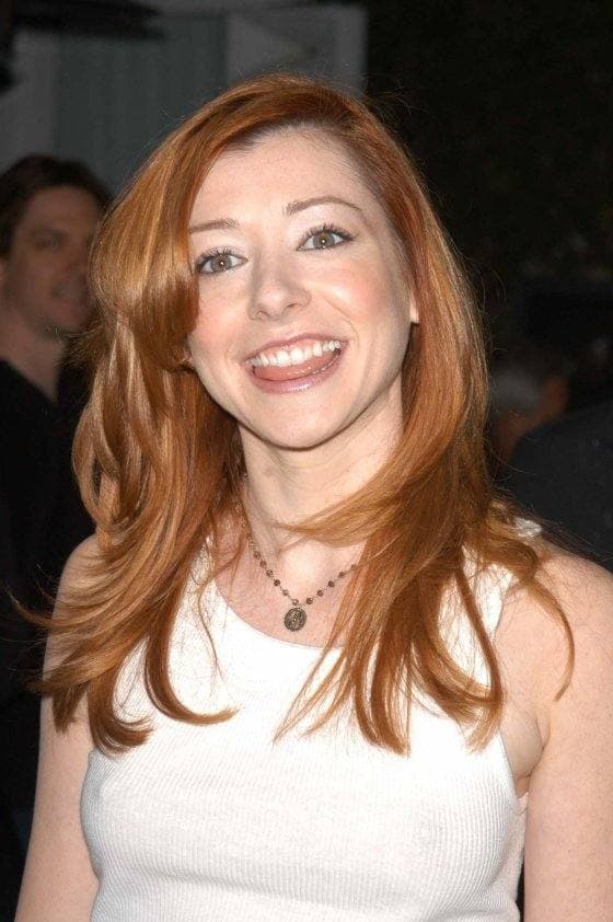 Alyson Hannigan smiling, with long red hair