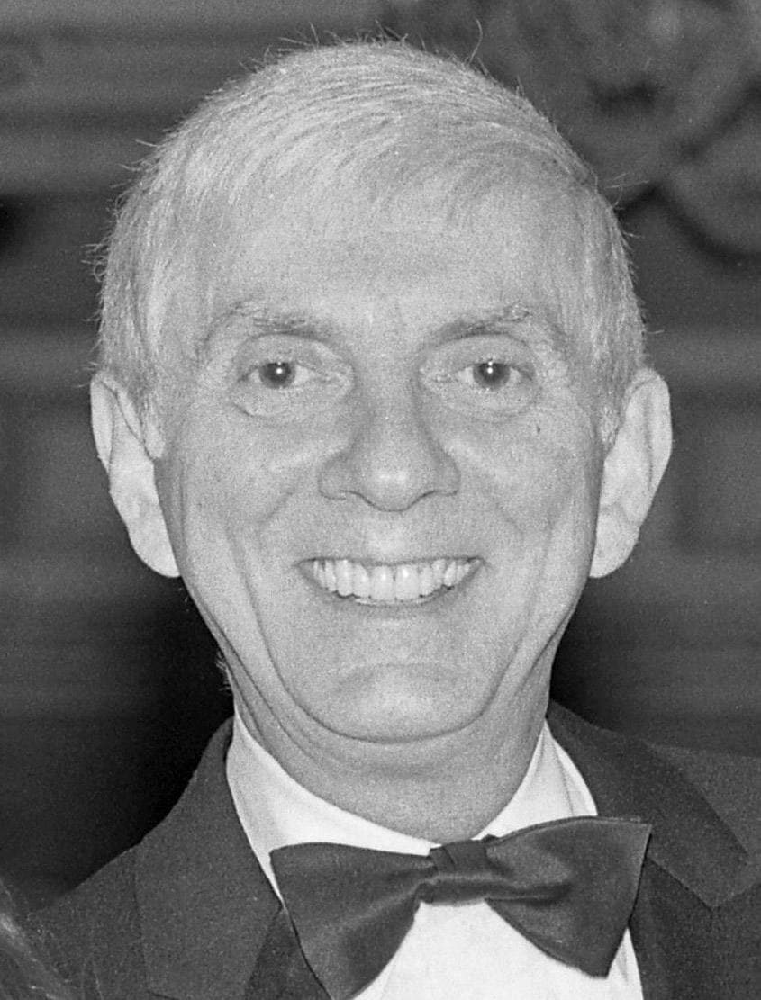 Aaron Spelling smiling, in a dinner jacket and bow tie