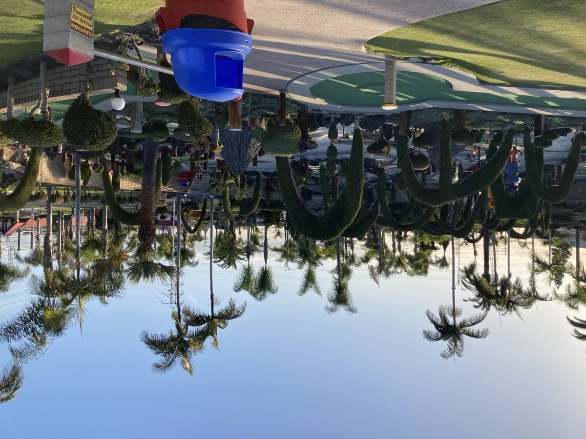 Miniature golf course with fake rocks and a castle at Golf N’ Stuff
