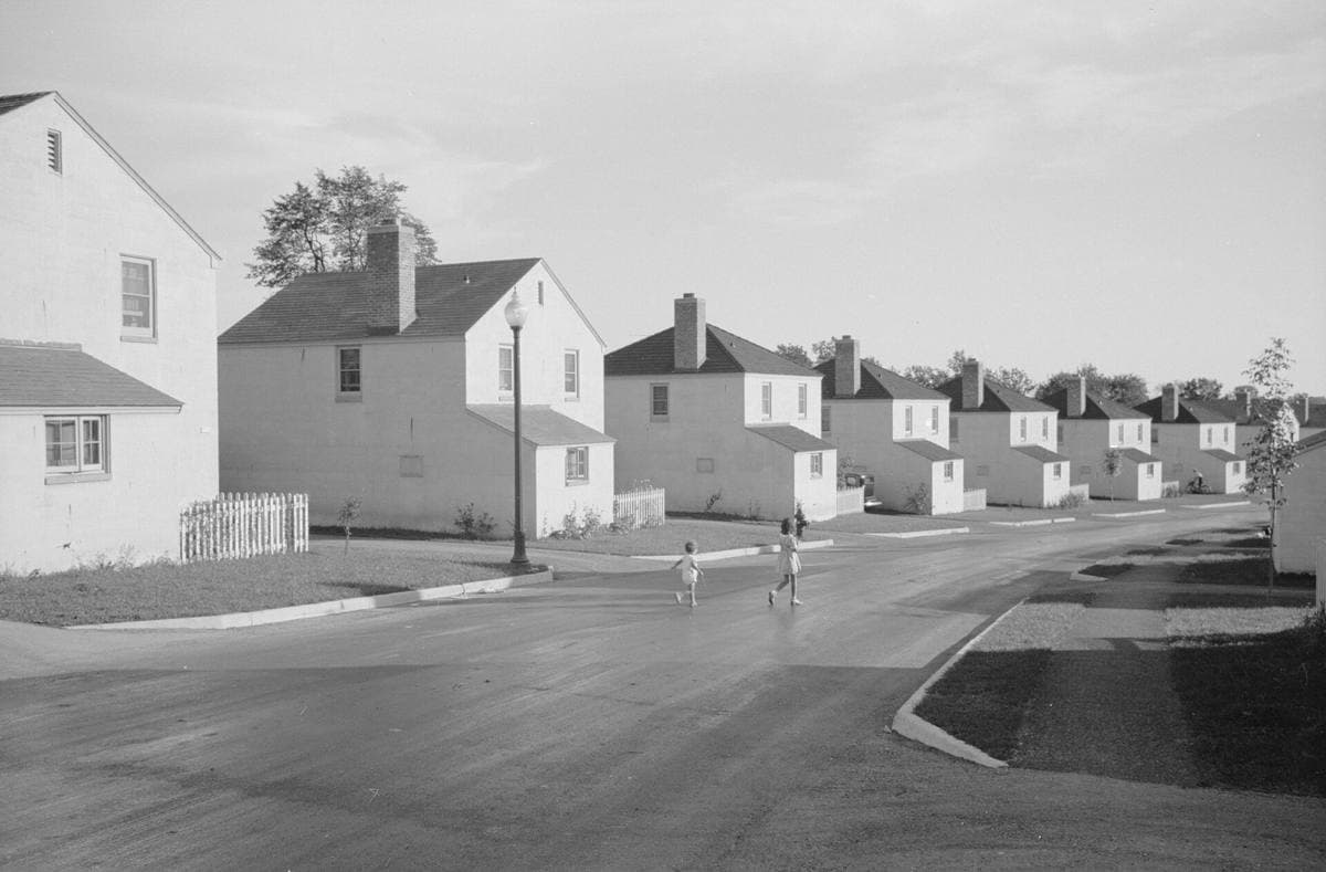 Rows of small new houses along a quiet street in a planned 1930s village