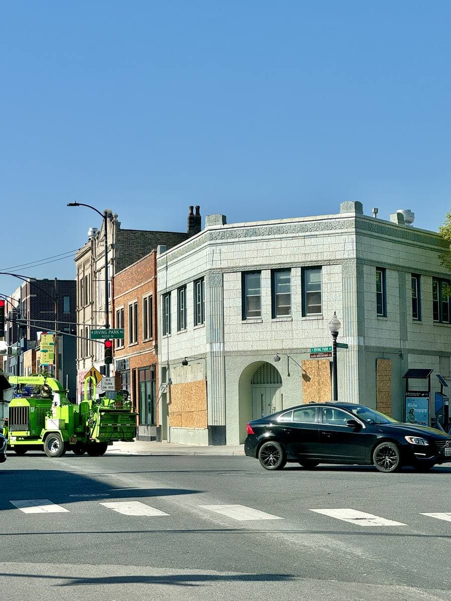 A street corner with a small early twentieth-century commercial building