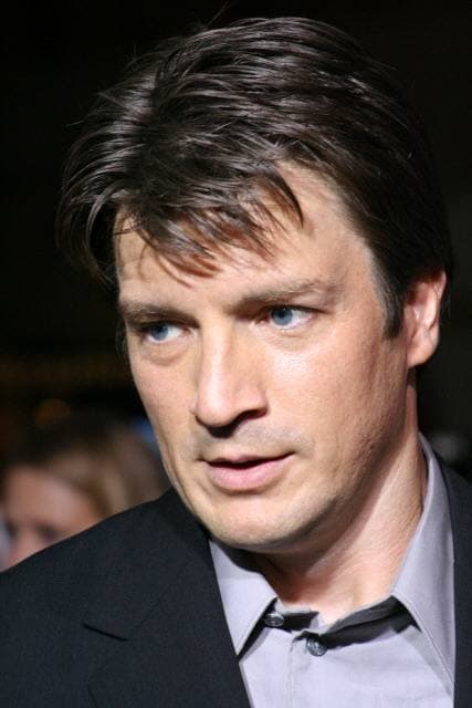 Nathan Fillion smiling at a film premiere