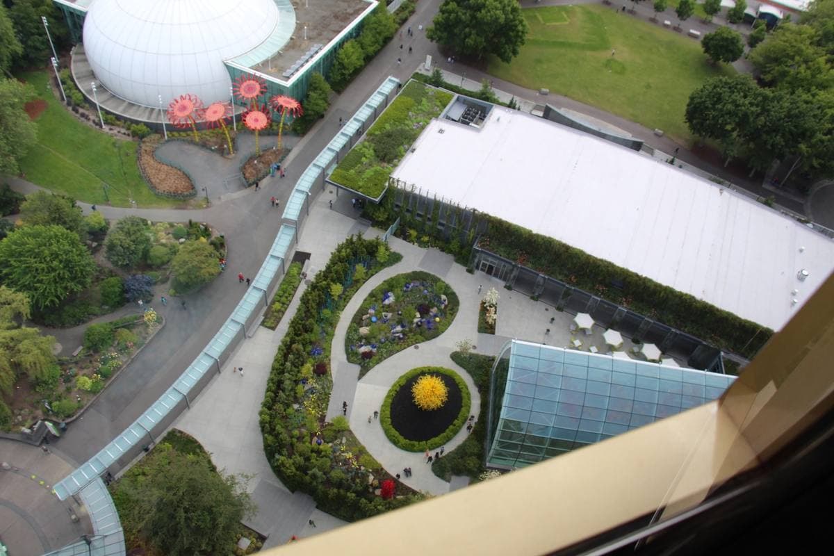 Looking down from the Space Needle on a garden, a glasshouse and a curving path