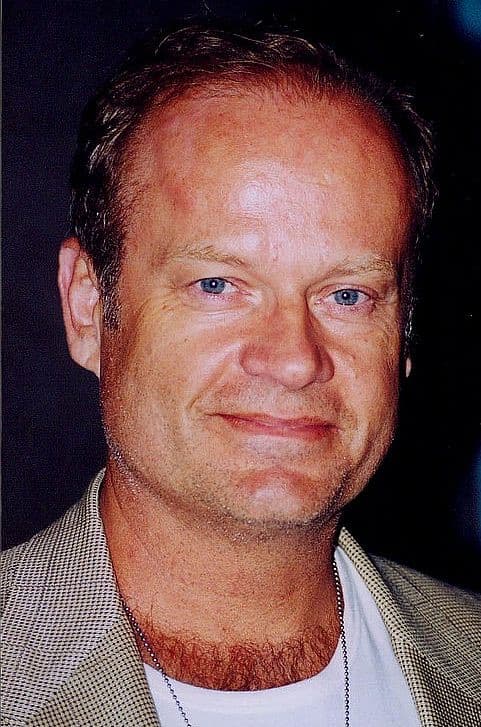 Kelsey Grammer smiling, close up, in a pale jacket