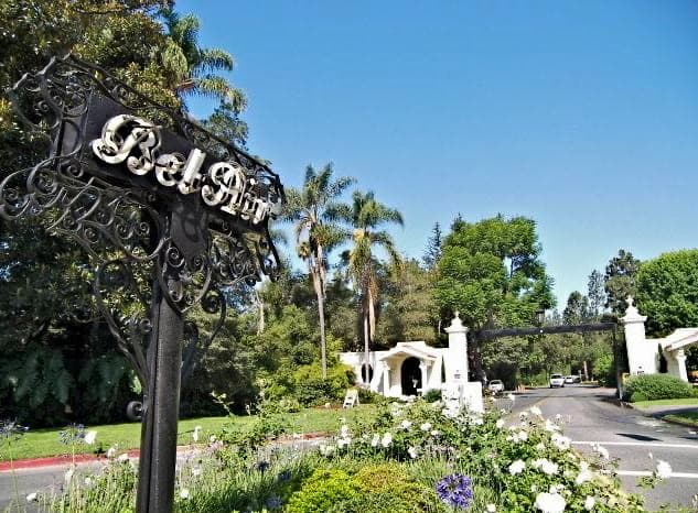 White gate piers and wrought iron at a road entrance