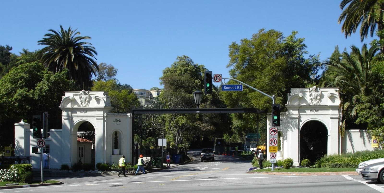 Ornate white gateposts and iron gates at the entrance to Bel-Air