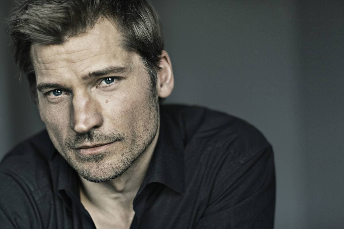 Nikolaj Coster-Waldau in a dark shirt, studio portrait