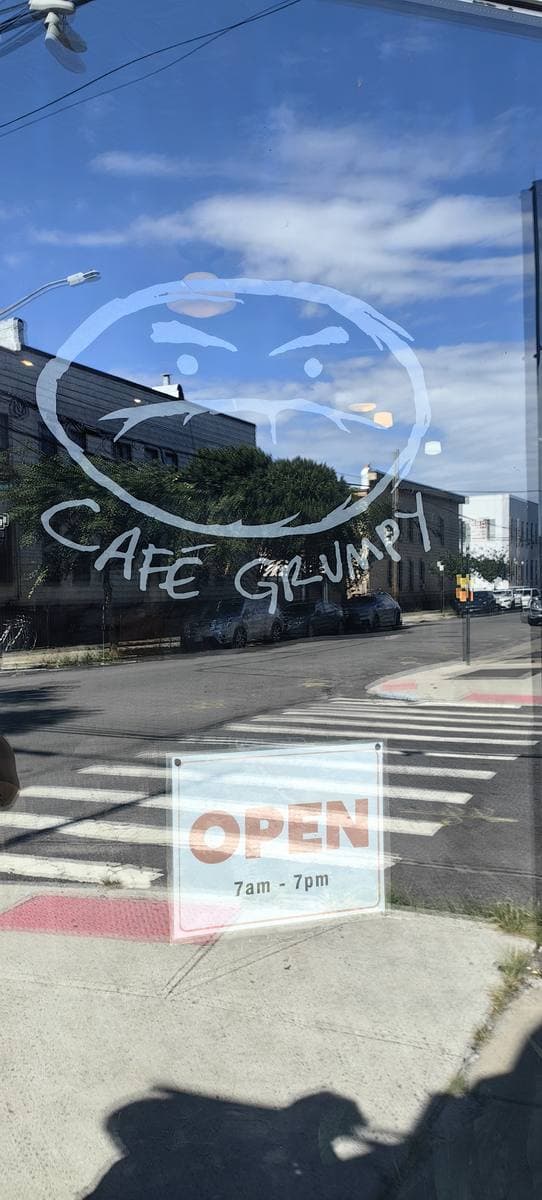 Café Grumpy’s painted door sign in Greenpoint