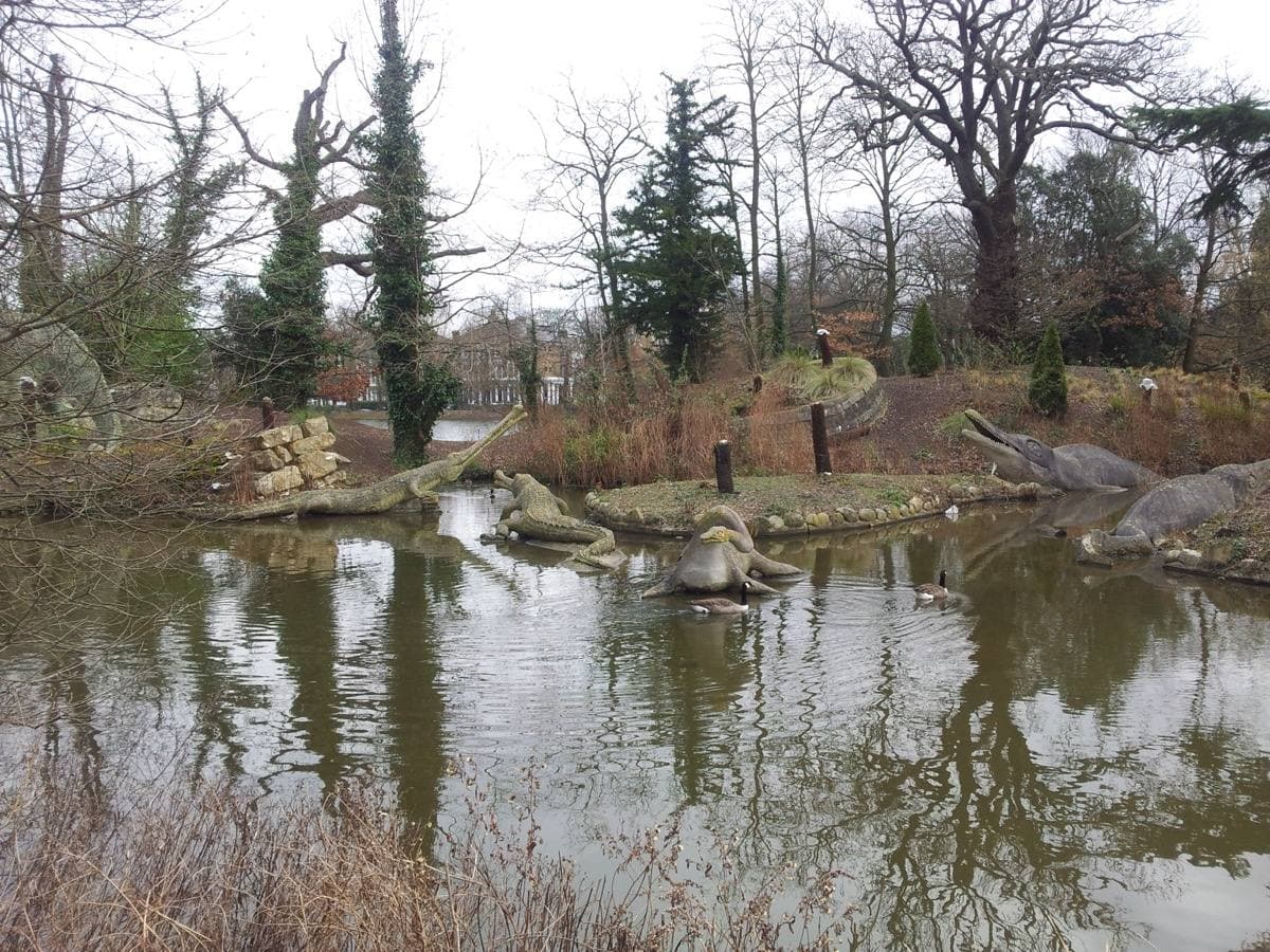Victorian dinosaur sculptures on an island across a lake