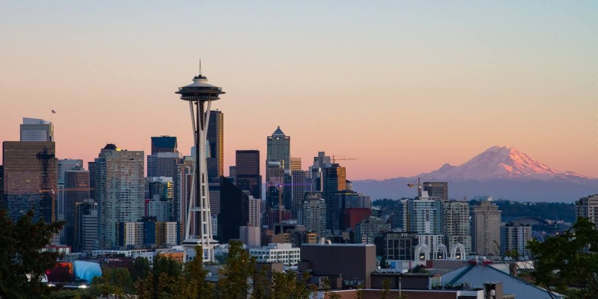 A wide view of the Seattle skyline and the Space Needle at dusk