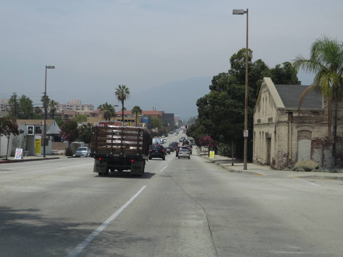 Brick shopfronts along a sunny Pasadena avenue