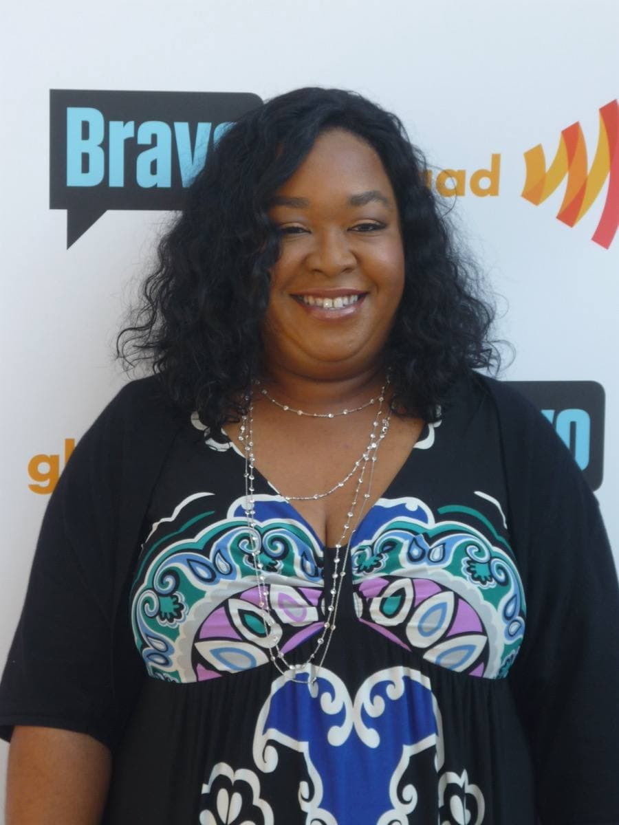 Shonda Rhimes smiling, in a dark top