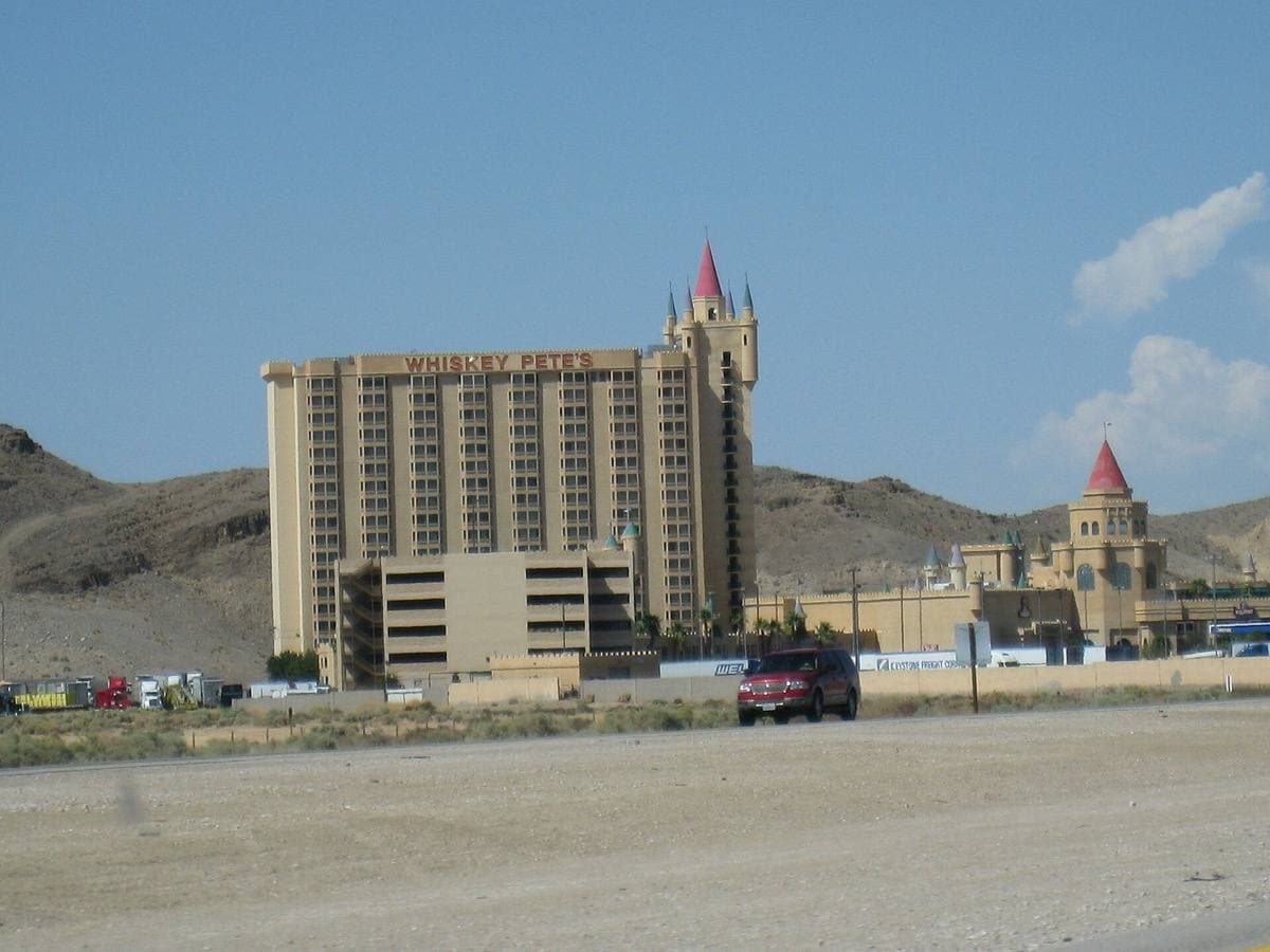 A castle-style roadside casino by a highway in the desert