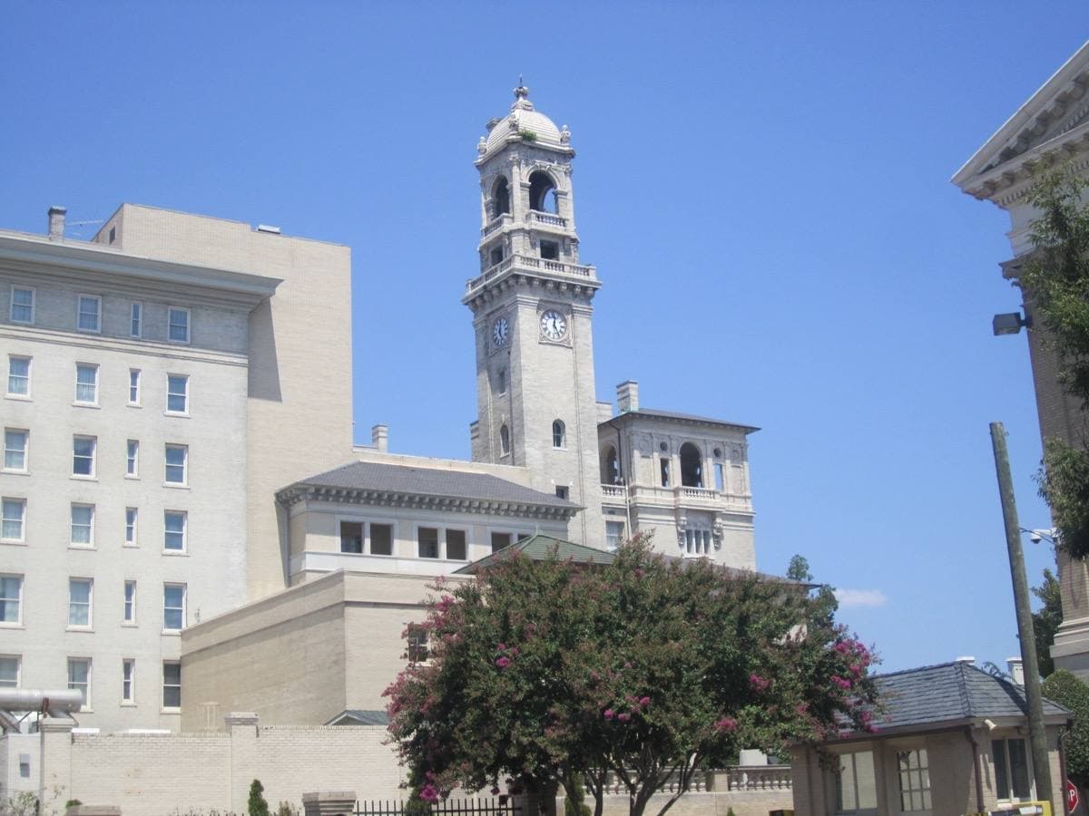 A Spanish Baroque hotel with a tall clock tower
