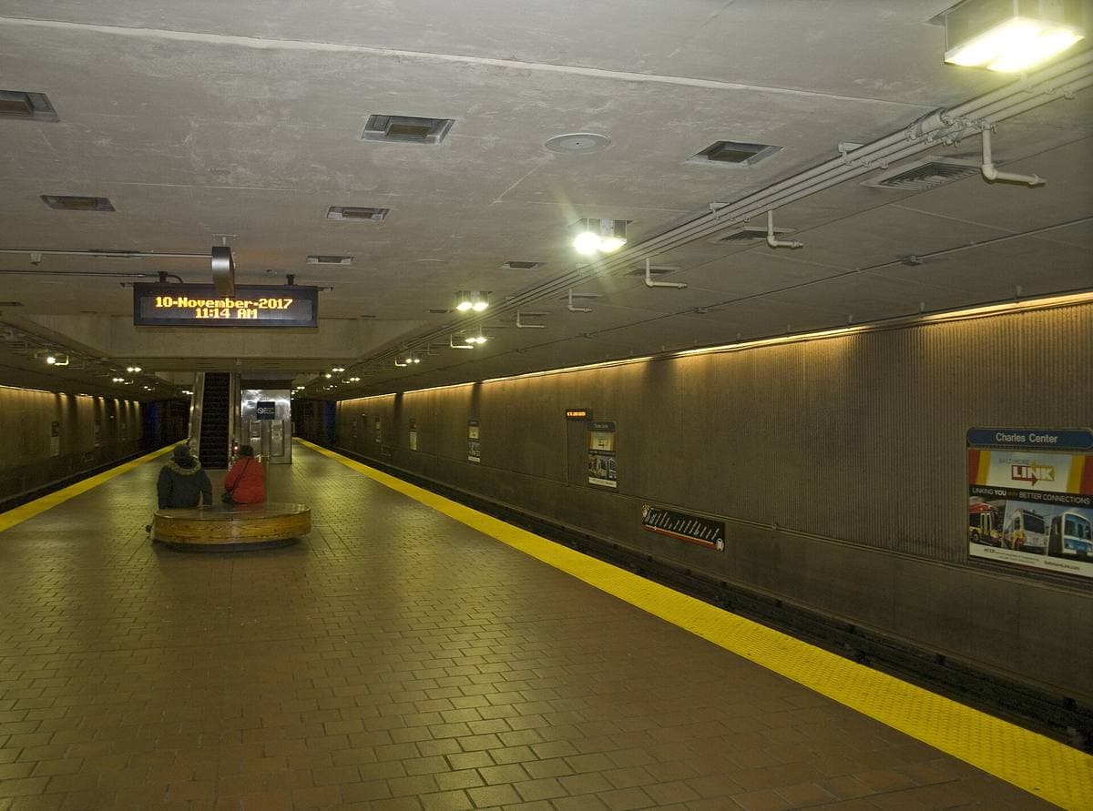 An underground metro platform with a vaulted ceiling