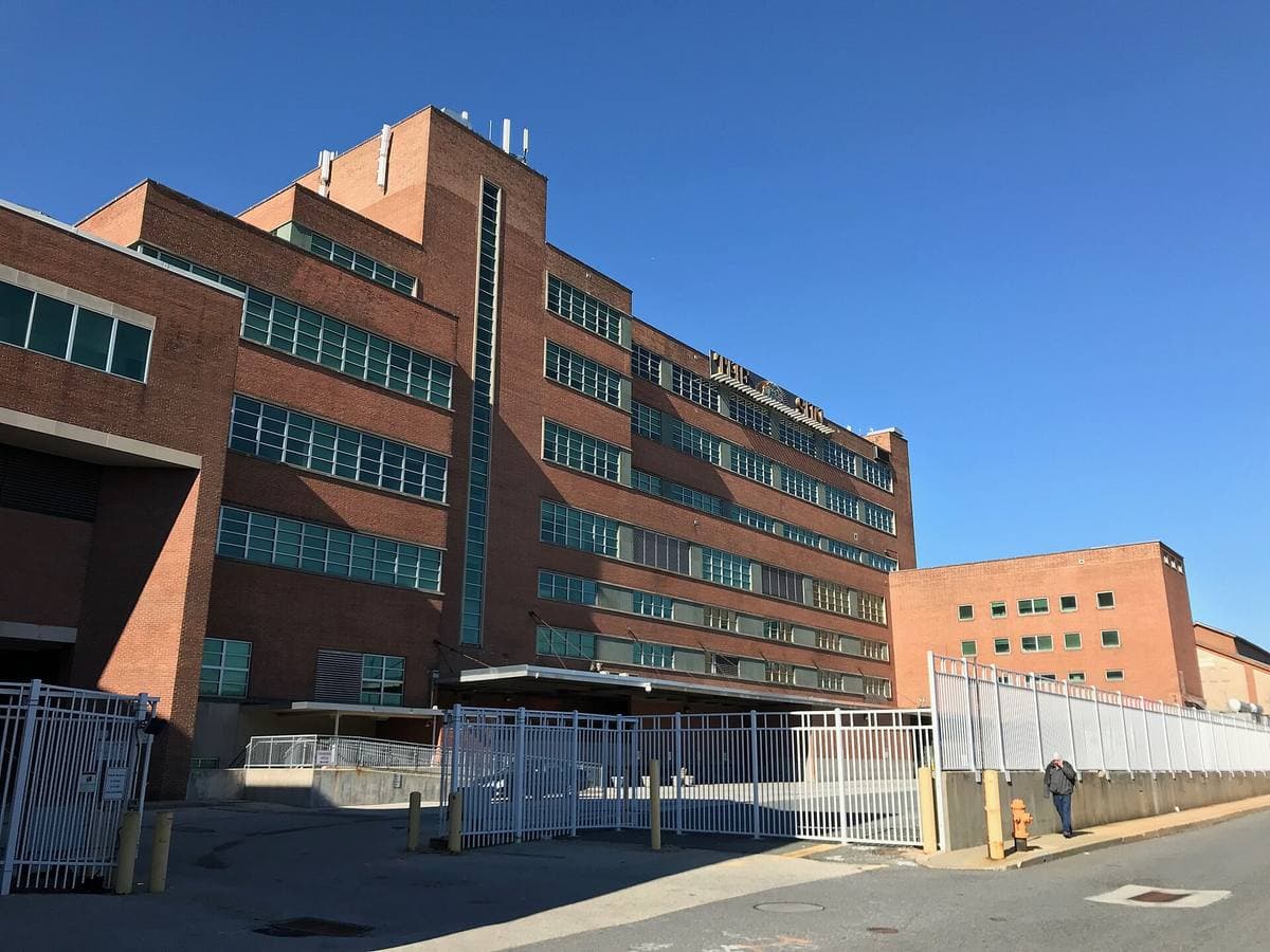 A long modern newspaper building with bands of windows