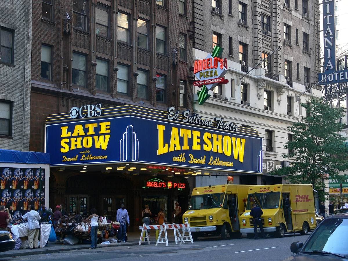 A theatre marquee on Broadway with a vertical sign