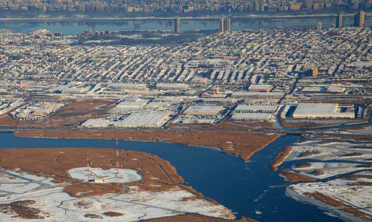 Aerial view of a dense New Jersey township beside the Hudson