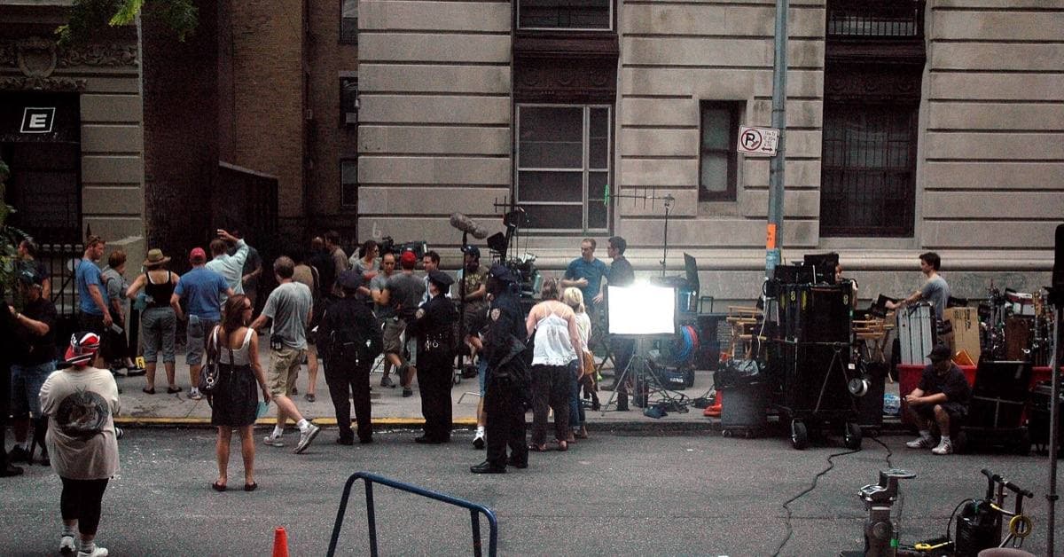 Film crew, lights and trucks along a residential Manhattan street