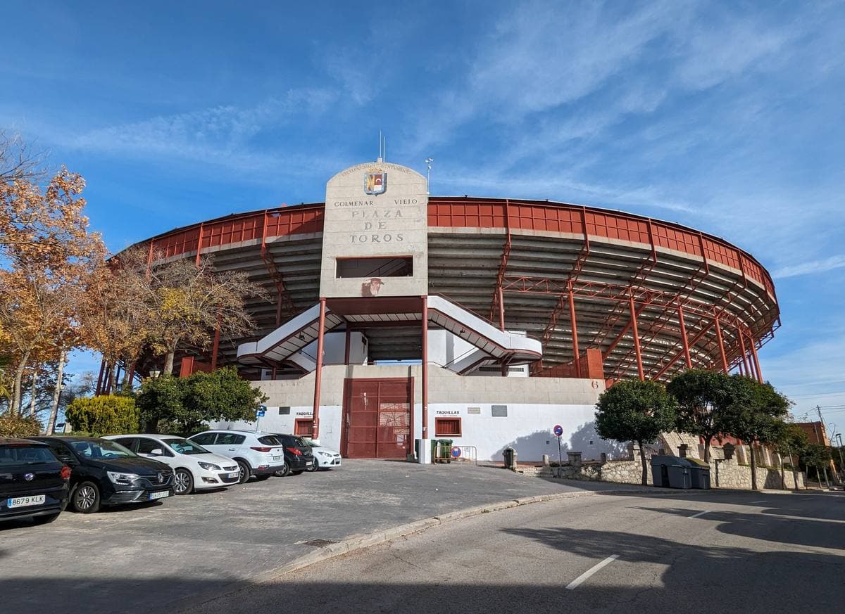 A town bullring under a blue sky