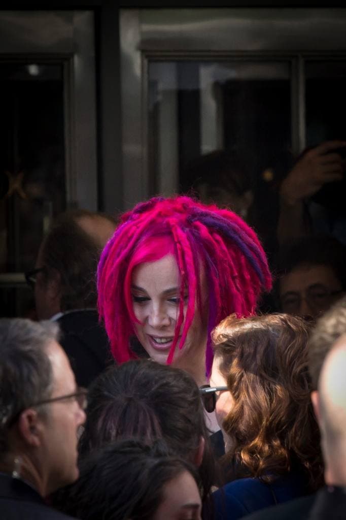Lana Wachowski with pink dreadlocks, smiling