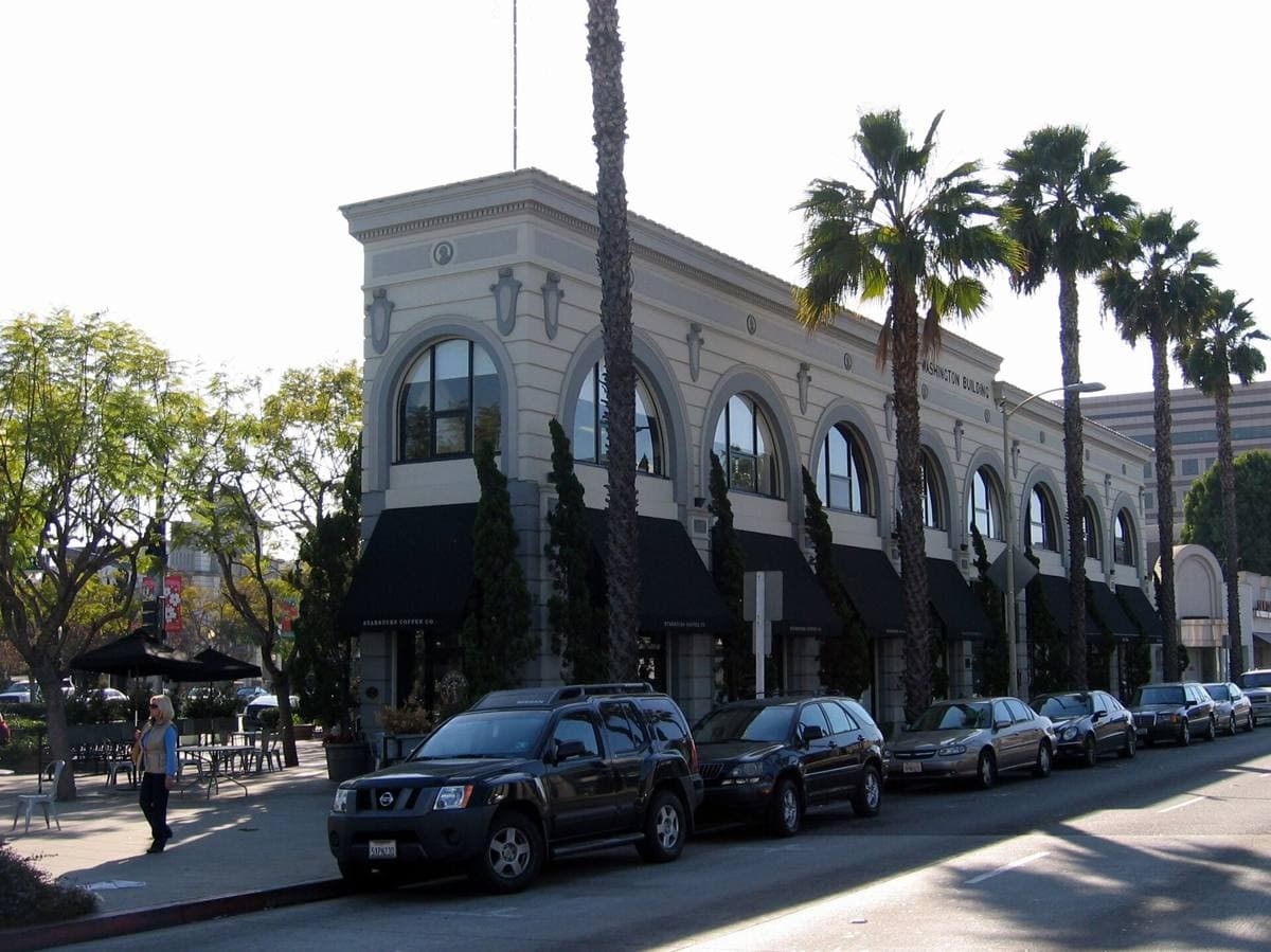 A corner commercial building with arched windows in Culver City