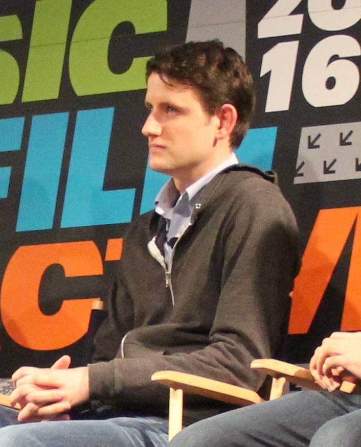 Zach Woods seated on a panel stage