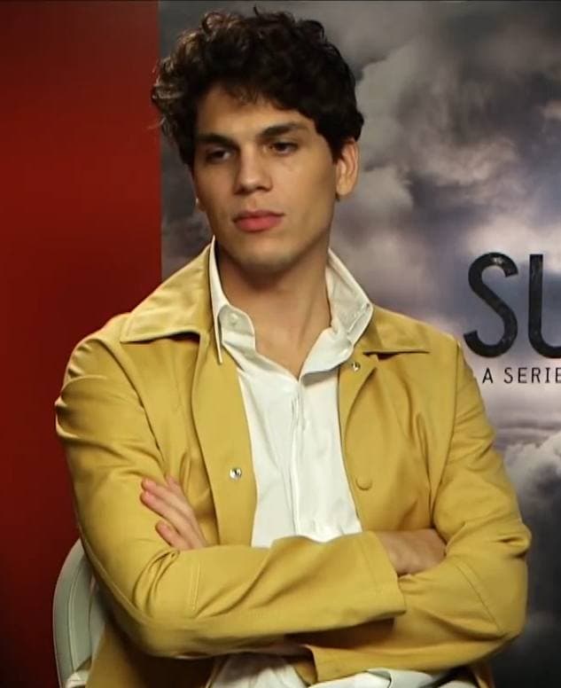 Eduardo Valdarnini in a mustard jacket, arms folded
