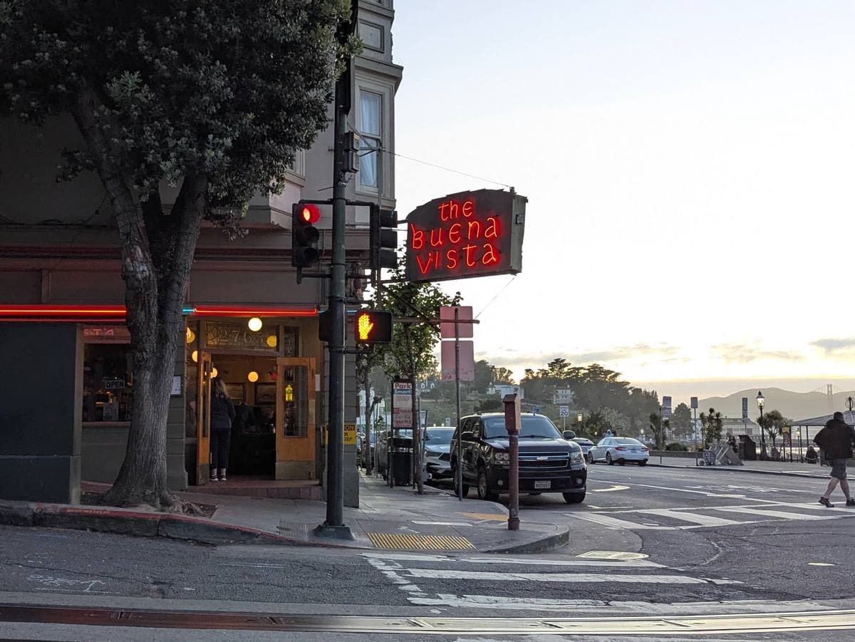 The corner café with its sign above the door