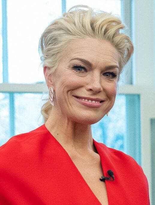 Hannah Waddingham in a red dress, smiling