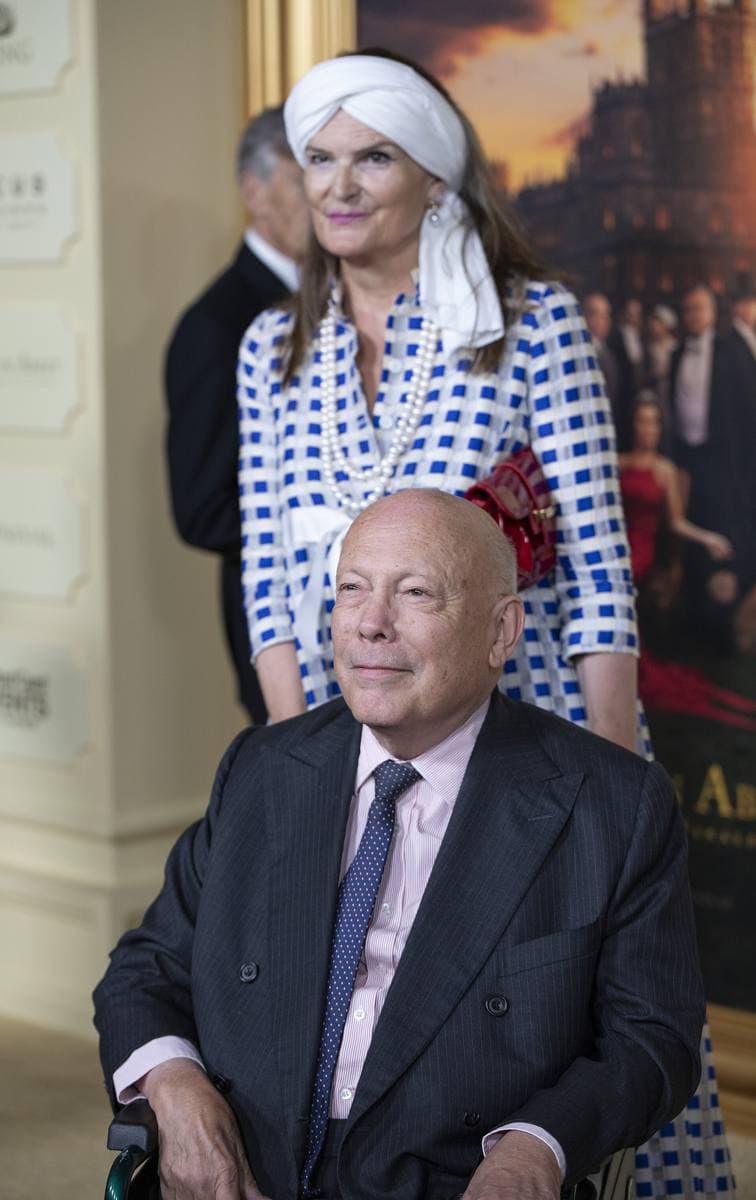 Julian Fellowes in a dark suit and tie