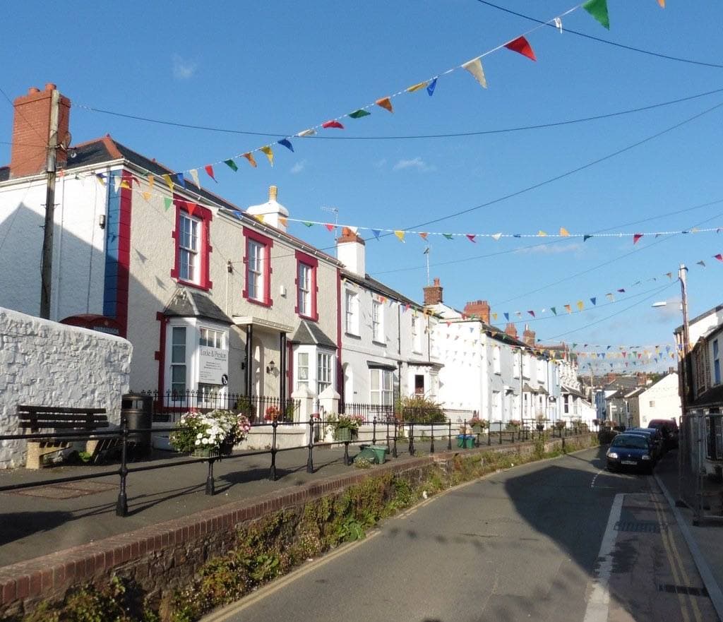 A village street of whitewashed and stone houses