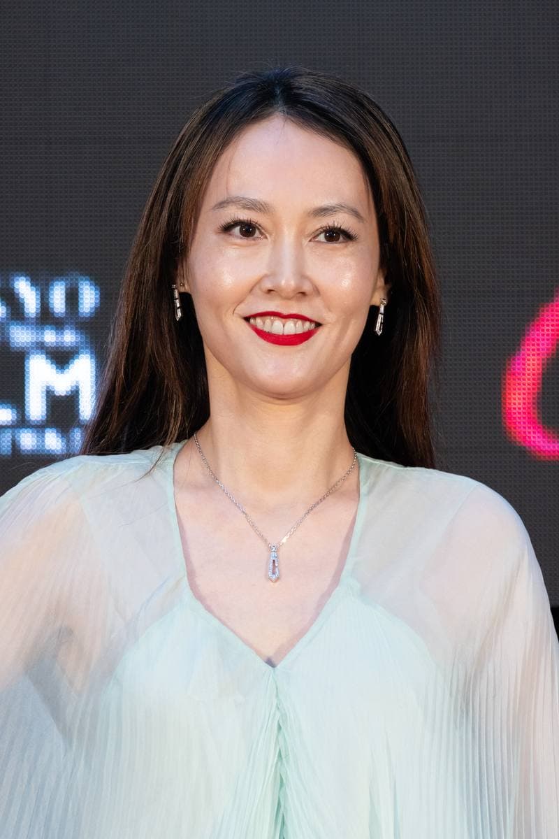 Rinko Kikuchi smiling in a pale green dress