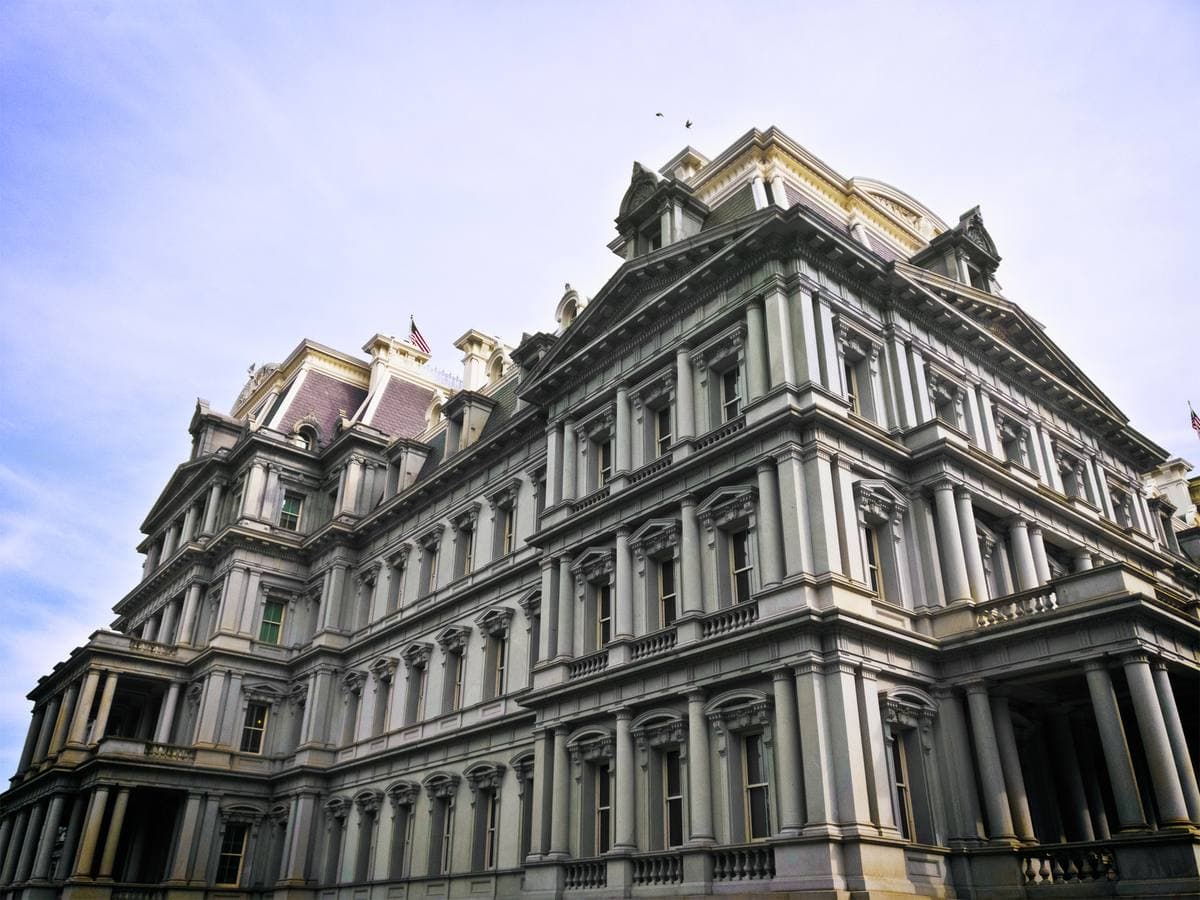 The grey granite Second Empire facade of the Eisenhower Executive Office Building seen from below