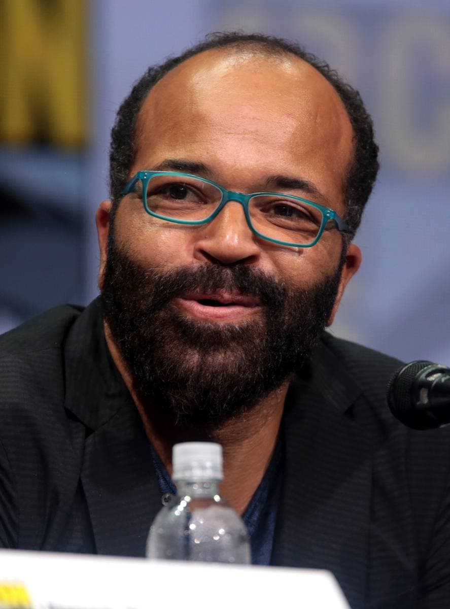 Jeffrey Wright in teal glasses, speaking