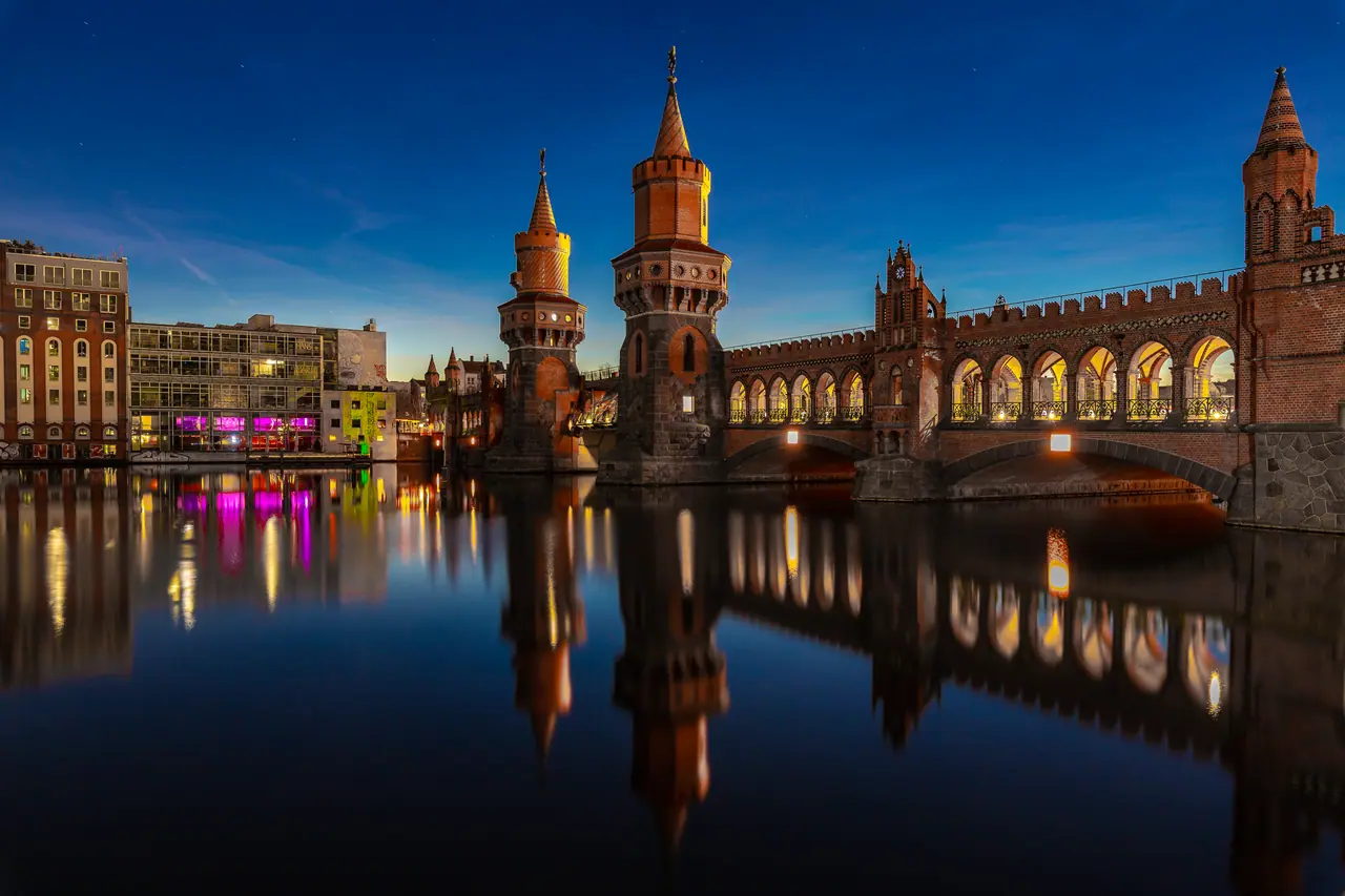 The Oberbaumbrücke at blue hour, reflected in the Spree