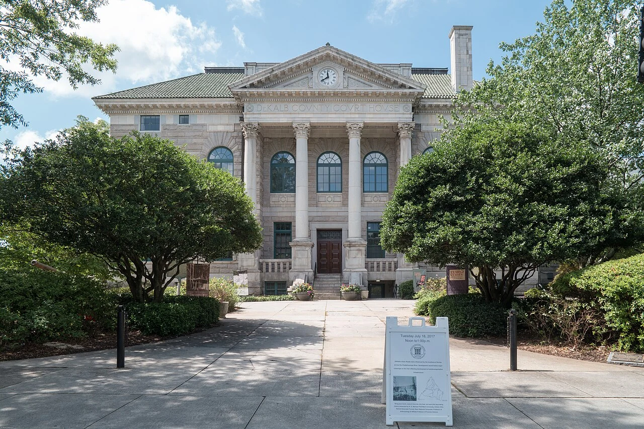 Historic DeKalb courthouse facade and entrance path, photographed in July 2017