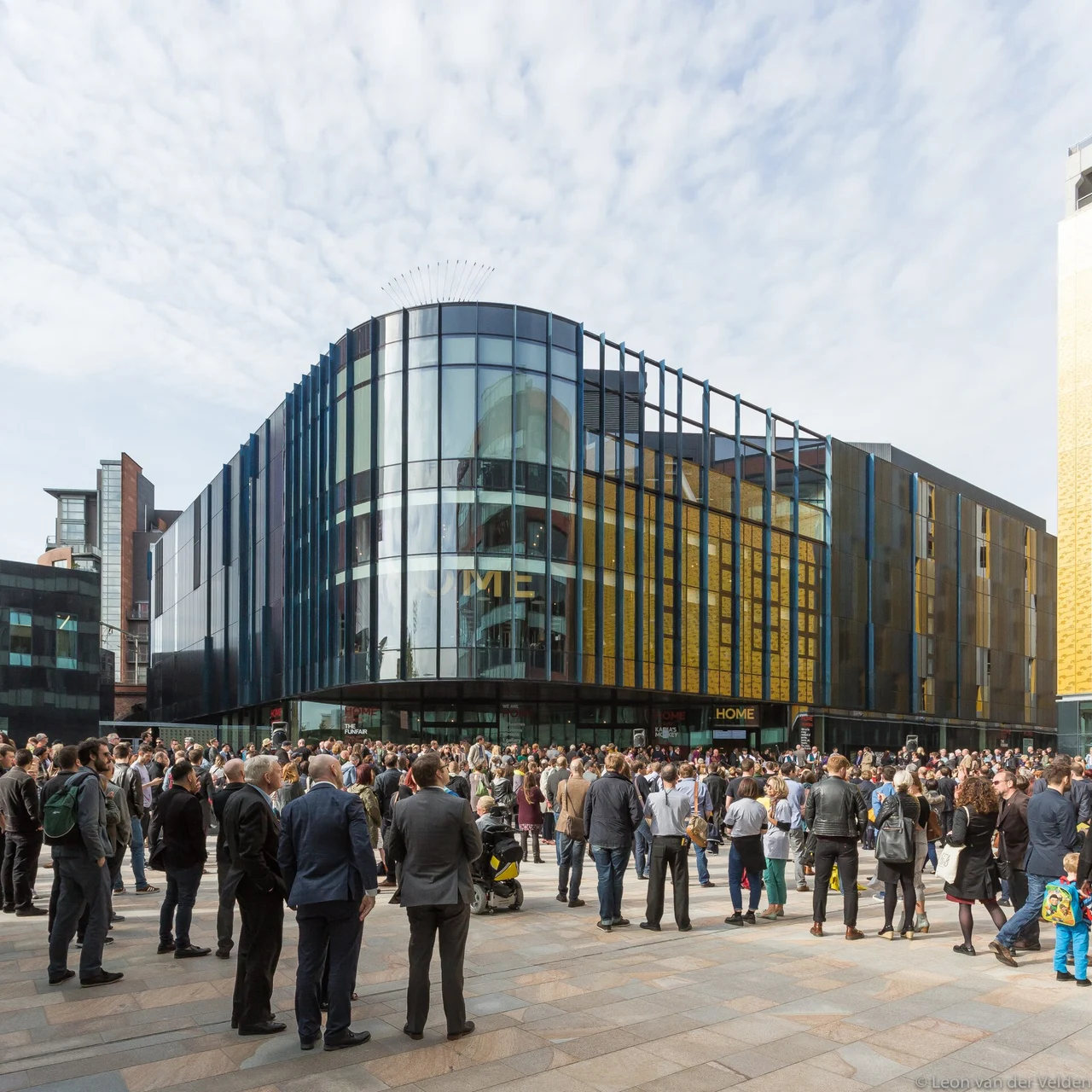 Crowd outside the glass-fronted HOME arts centre
