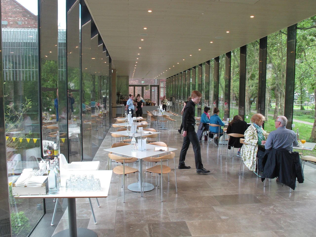 Glazed cafe space at the Whitworth overlooking trees