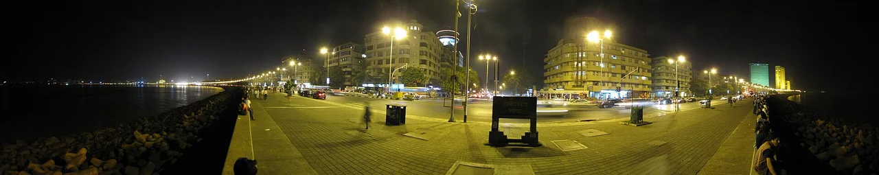 Panoramic night view of the promenade and buildings along Marine Drive