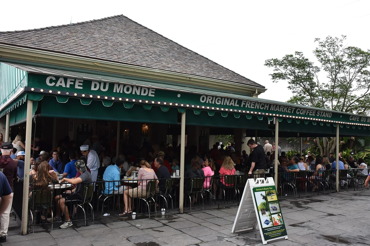 Café du Monde’s green awning above the busy open-sided French Quarter café.
