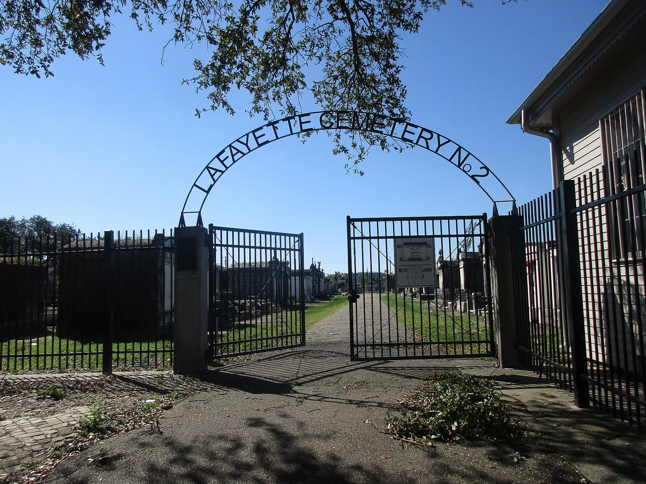 The gated entrance marked Lafayette Cemetery No. 2, with tombs visible beyond.