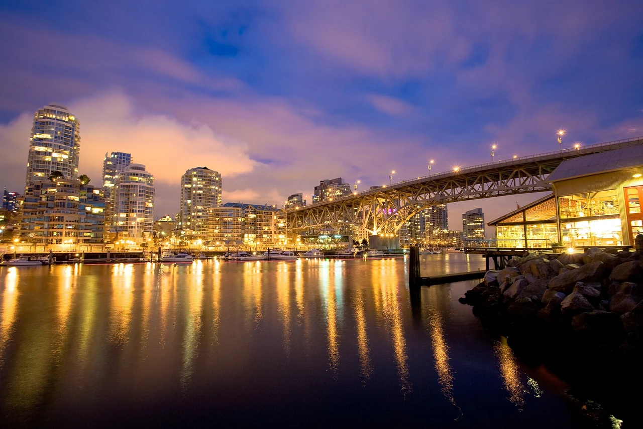 Vancouver waterfront and Granville Bridge reflected in False Creek