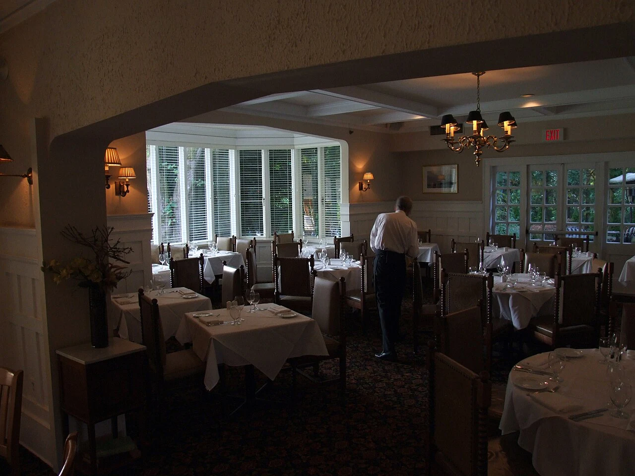 Tables and windows inside the Hart House restaurant, formerly the Avalon home.
