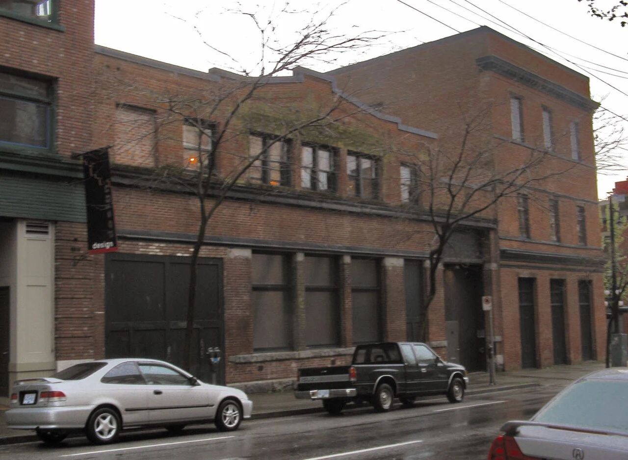 The Warehouse Studio’s brick building at 100 Powell Street in Gastown, photographed across the road.