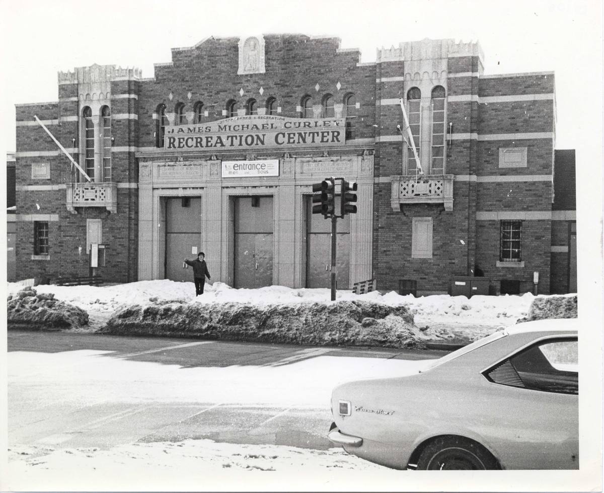 Black-and-white photograph of the brick L Street Bathhouse in snow