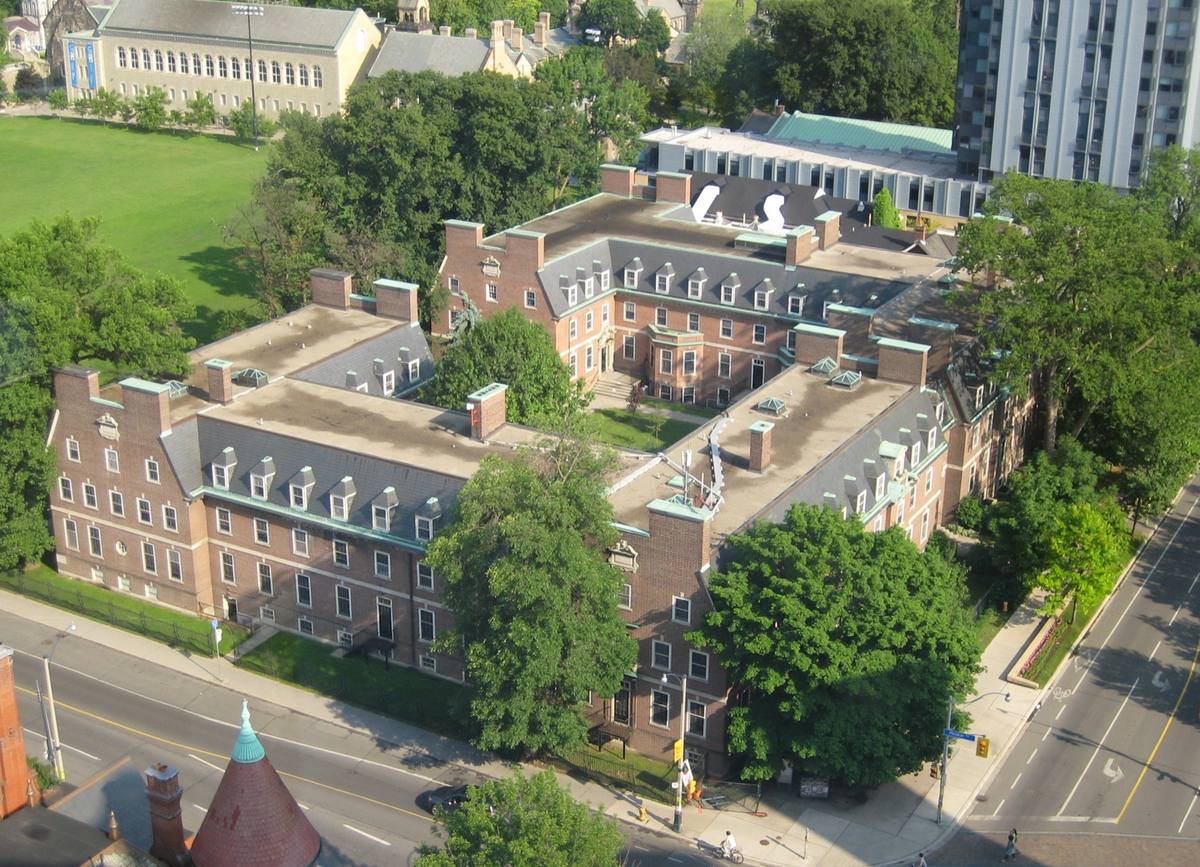 Aerial view of Whitney Hall’s red-brick wings round a courtyard