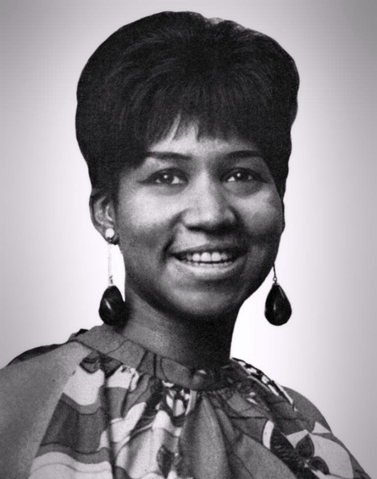 Aretha Franklin in a black-and-white portrait, looking past the camera